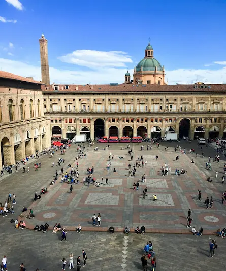 the Piazza Maggiore square image of the Piazza Maggiore square with many people walking around
